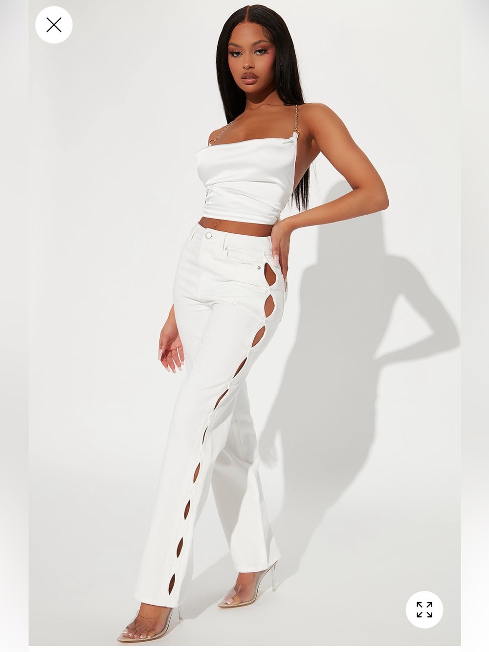 Fashion Nova White high-waisted jeans with side cut outs (Size 11)
